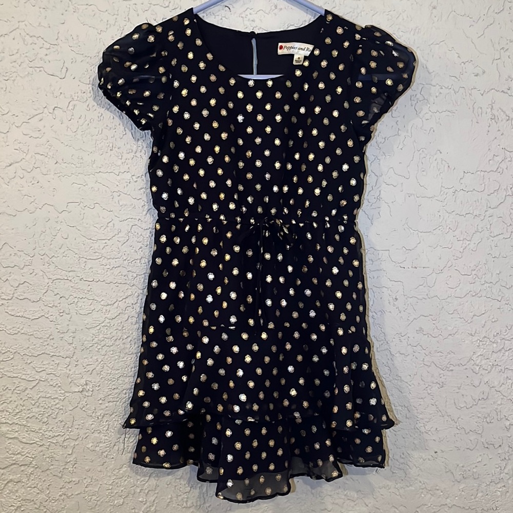 Adorable little girls dress in navy with gold polka dots.